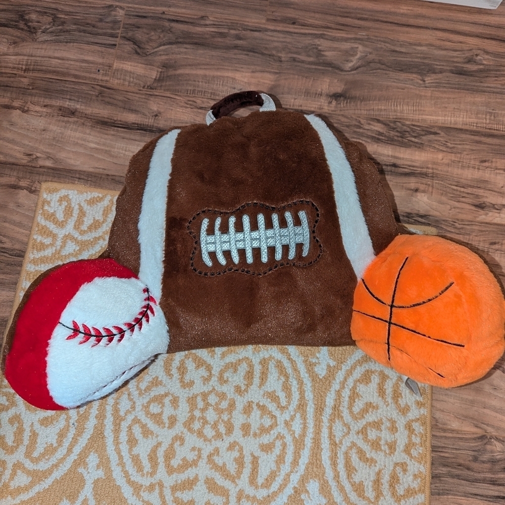 Like new Kids sports back pillow with book pocket in the back.